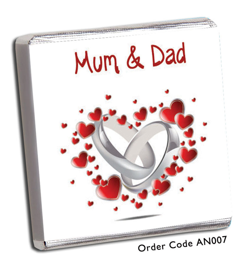 silver wedding rings surrounded by red hearts