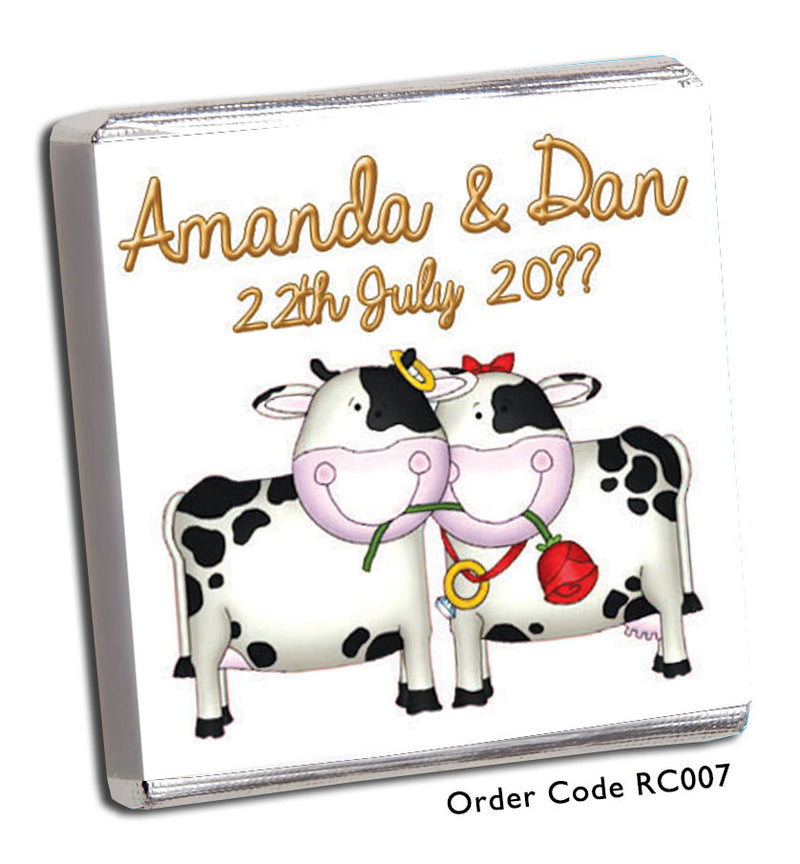 two cartoon cows with red rose in their mouths.