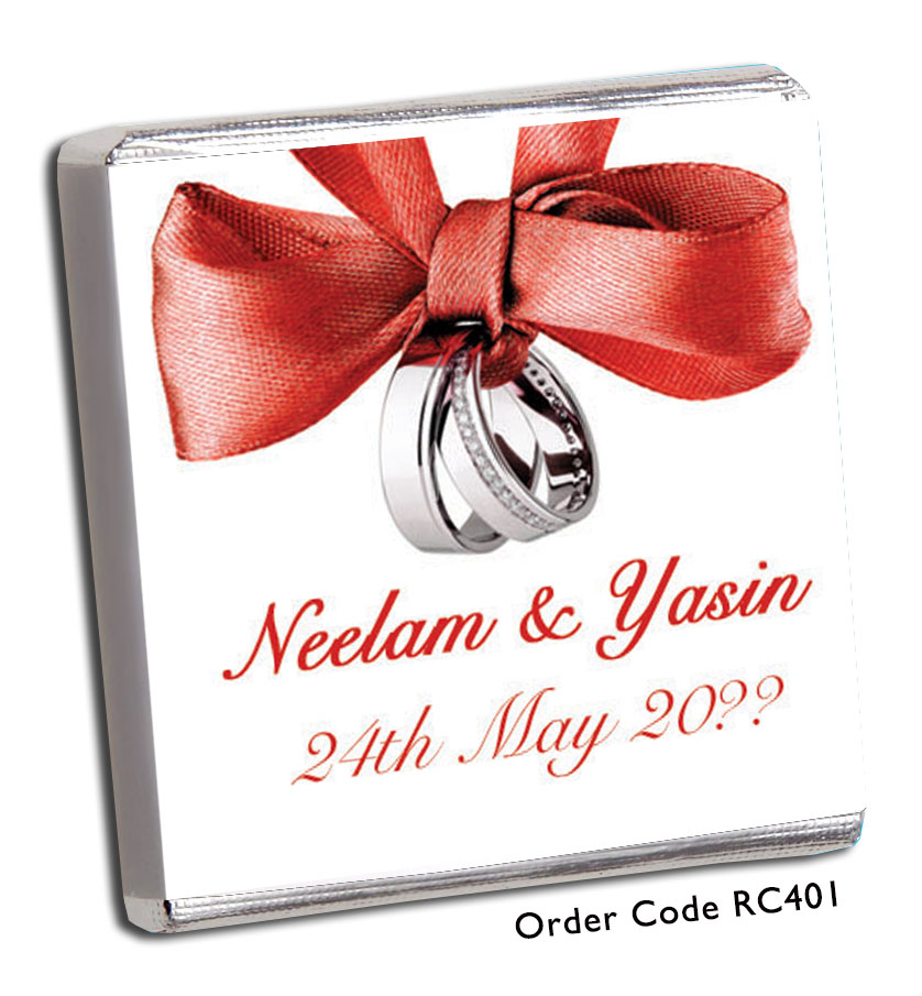 red ribbon and silver rings wedding favour