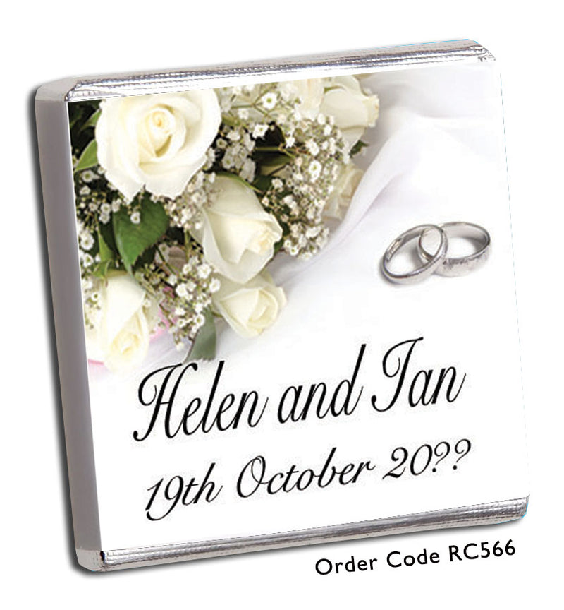 silver rings and white roses wedding favour